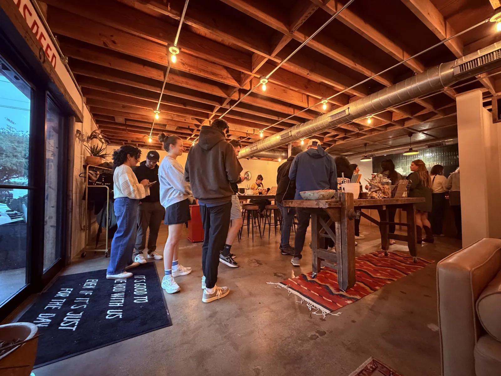 Guests gathered inside Moon Wolf Provisions.