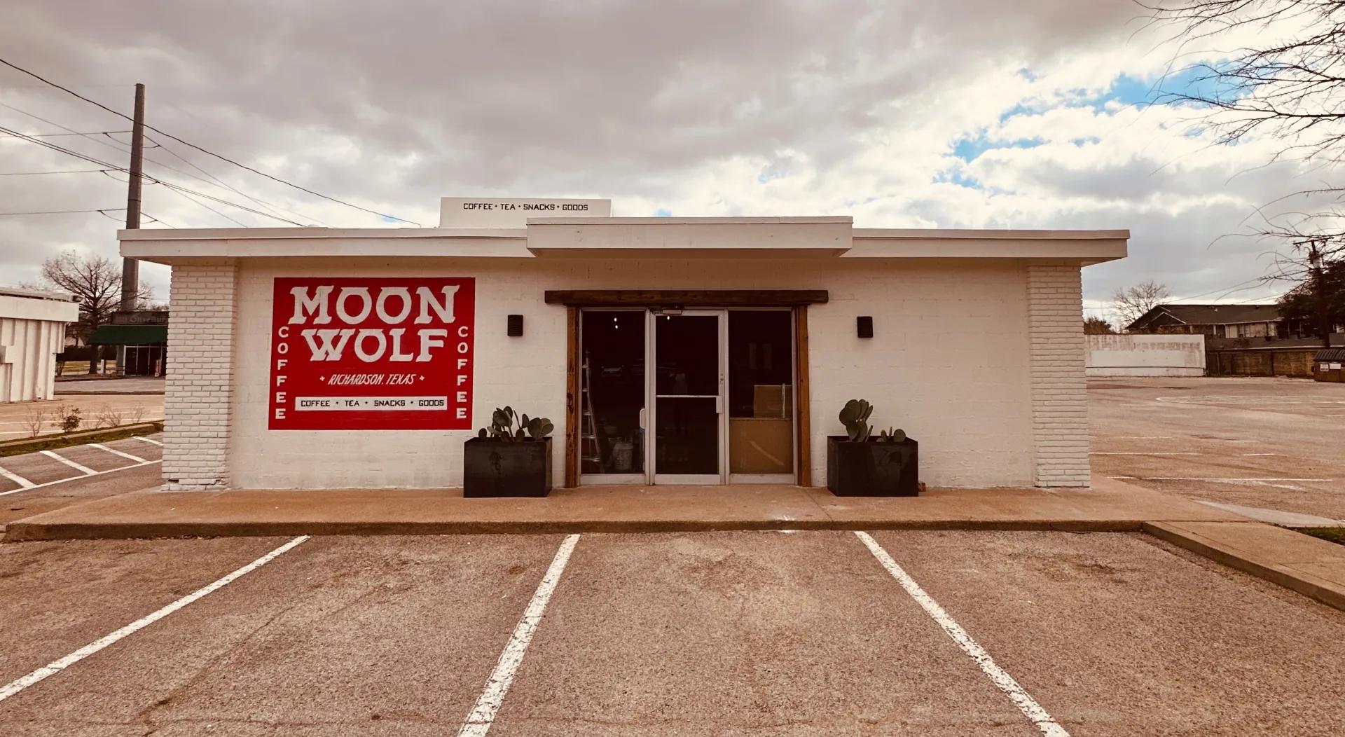 Moon Wolf Provisions storefront with its hand-painted wordmark and cowgirl mural.
